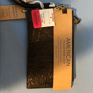 Wristlet with charger for phone